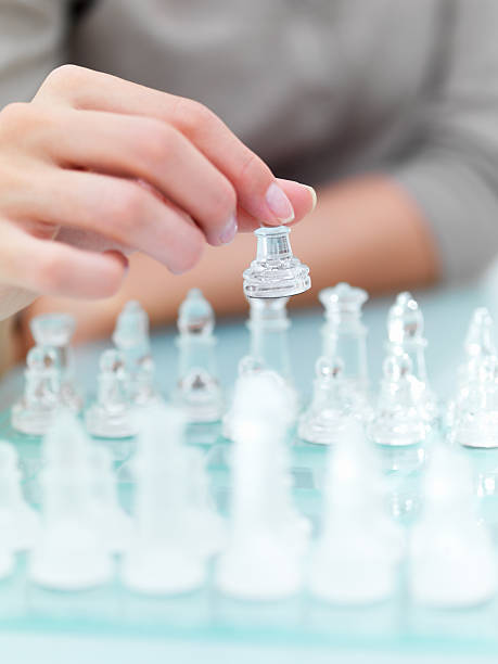 istock Mid section view of a woman playing chess 160105952