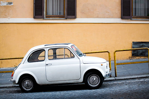 istock vintage compact car on Italian street 160105975