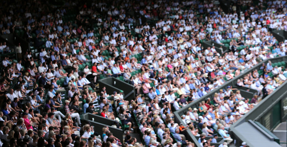 Wimbledon, London, UK - July 10, 2017:  Blurred crowd spectators watching the tennis match at Centre Court.