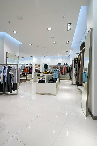 The interior of a clothing store with women's tops stock photo