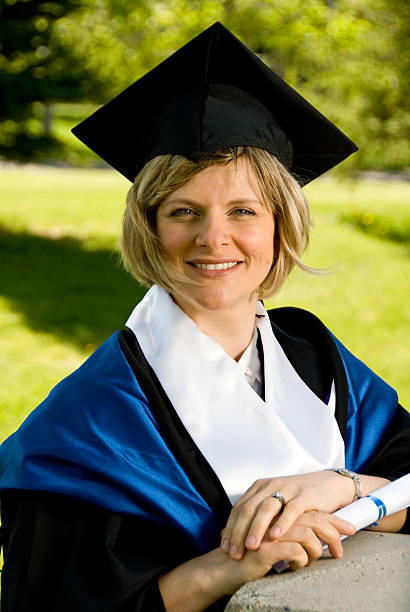 istock Woman in Graduation Cap and Gown 160108107