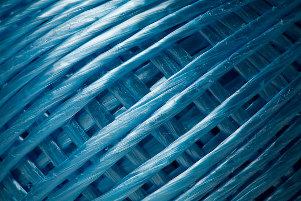 Ball of blue string forming beautiful patterns stock photo