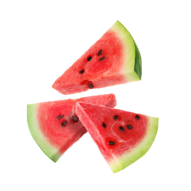 istock Slices of fresh juicy watermelon falling on white background 1601087129