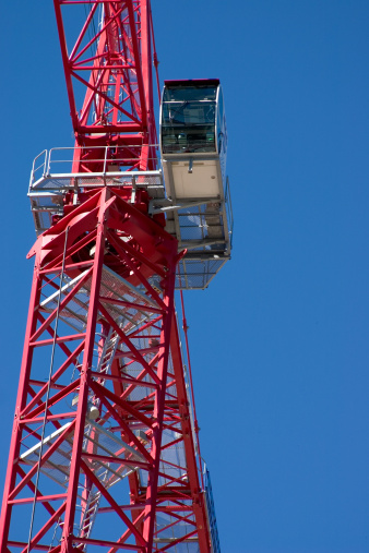 large crane against bright blue sky