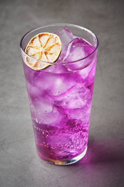 istock Refreshing drink with purple ice with dehydrated orange slice 1601095855