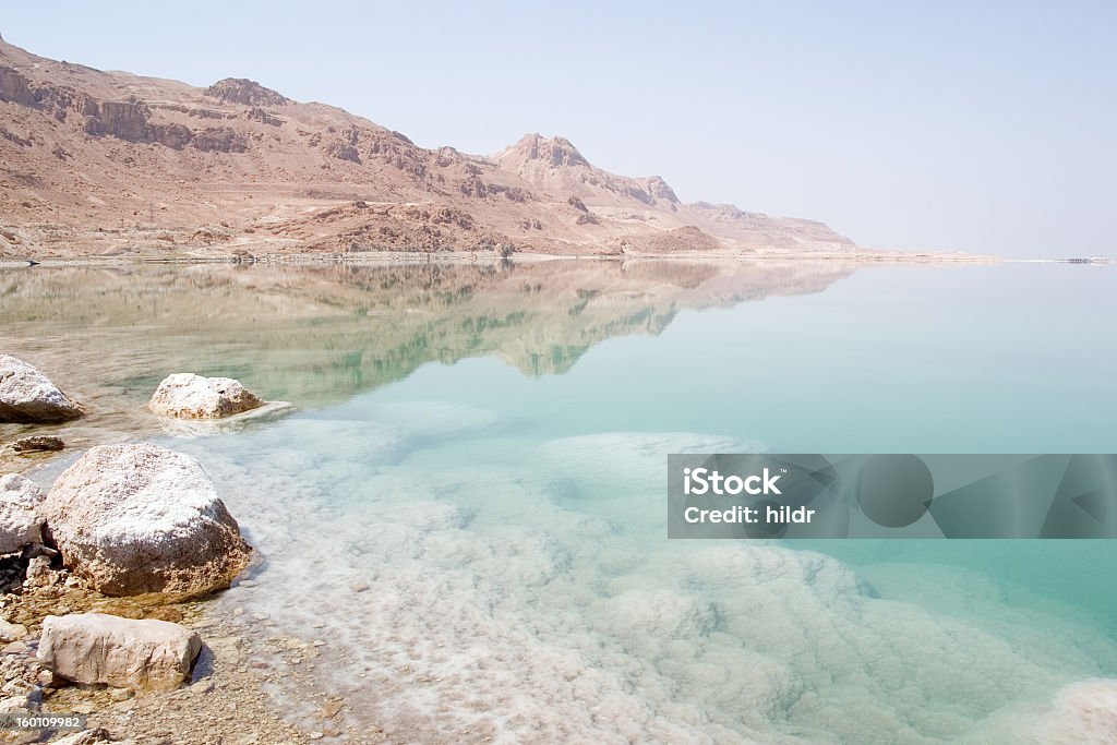 The Dead Sea which is located in Israel  The view on the Dead Sea and the surrounding hills. Coastline Stock Photo