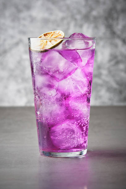 istock Refreshing drink with purple ice with dehydrated orange slice 1601105242