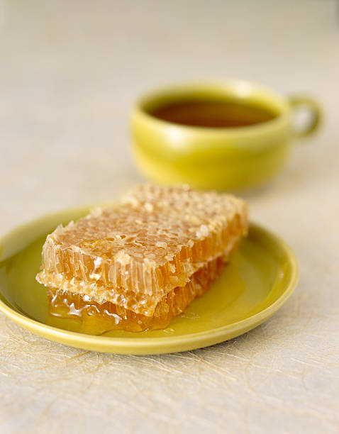 Plated Honeycomb and Cup of Tea stock photo