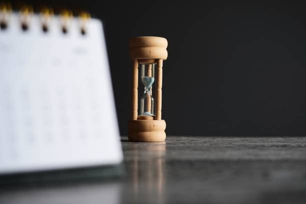istock Close up image of calendar and hourglass with copy space. 1601111148