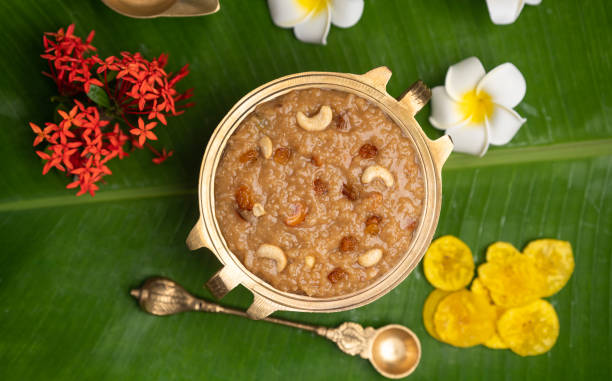 istock Payasam in brass uruli with banana chips and flowers 1601112209