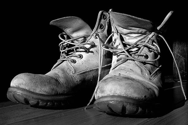 worn boots black and white stock photo