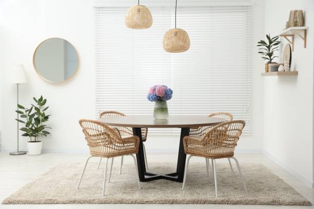 istock Table, chairs and vase of hydrangea flowers in dining room. Stylish interior 1601119496