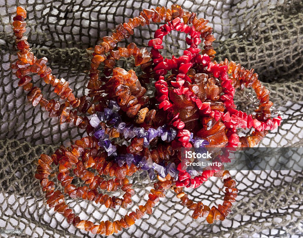 Ambers and coral Natural composition with ambers and coral necklace. Colors Stock Photo