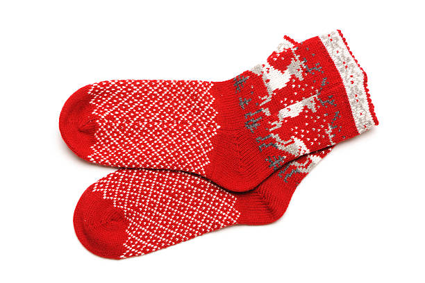 istock Pair of red Christmas socks with reindeer on white back 160114179