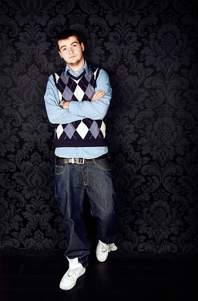 hip-hop style young guy against a black background stock photo