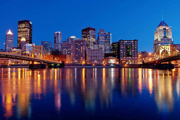 istock Pittsburgh Skyline with water view at night with clear sky 160115035