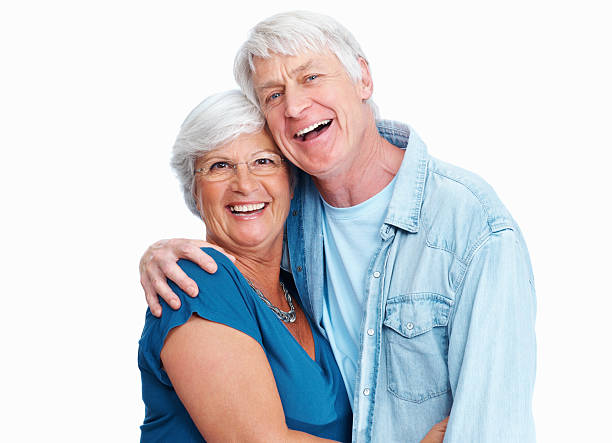 Love through the ages Portrait of a happy senior couple smiling together on a white background couple isolated wife husband stock pictures, royalty-free photos & images