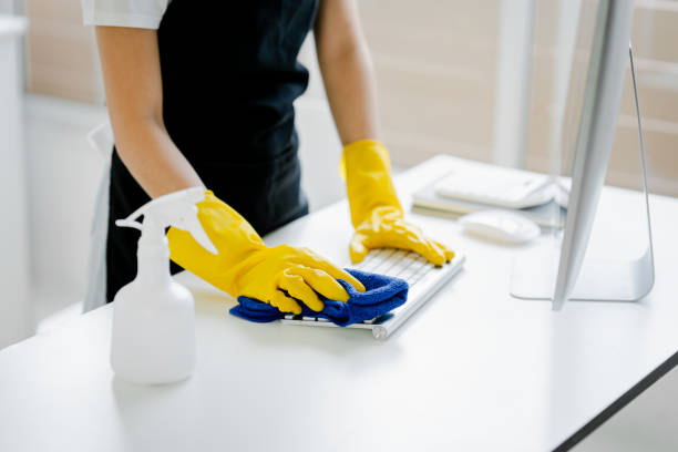 istock Young woman using a computer keyboard cleaning cloth to disinfect the officeoffice cleaning staff cleaning maid 1601152991