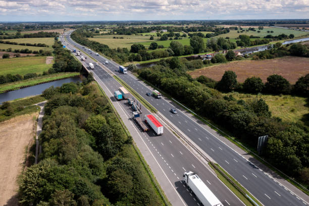 istock Aerial view directly above a busy UK motorway bridge over a river 1601154682