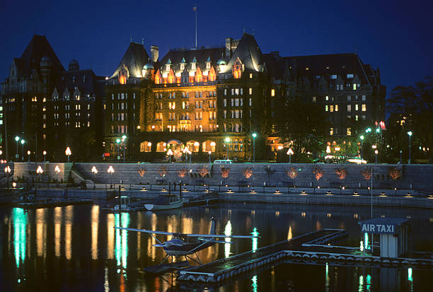 Empress Hotel at night, circa 1976 The Empress Hotel on the waterfront in Victoria, British Columbia. hearkencreative stock pictures, royalty-free photos & images