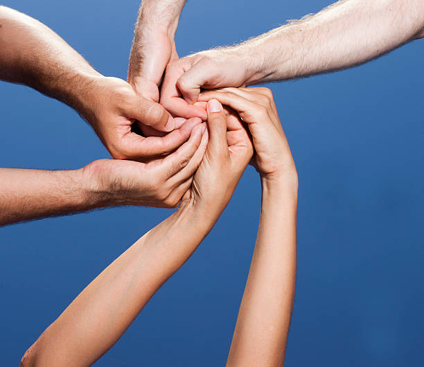 istock Spiral out of three hands 160116032