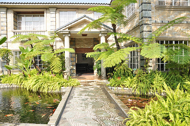 Luxury villa with fish pond stock photo