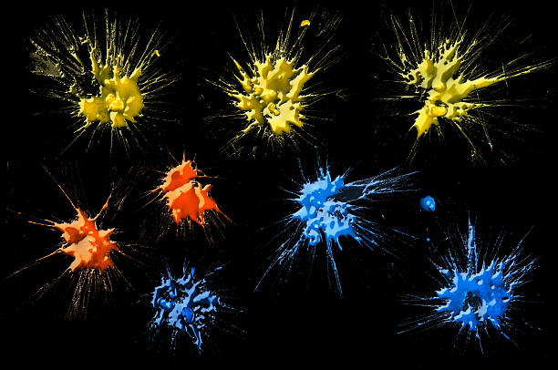 Paintball Splats (On Black) Yellow, Orange and Blue Paintball Splats. paintball photography stock pictures, royalty-free photos & images
