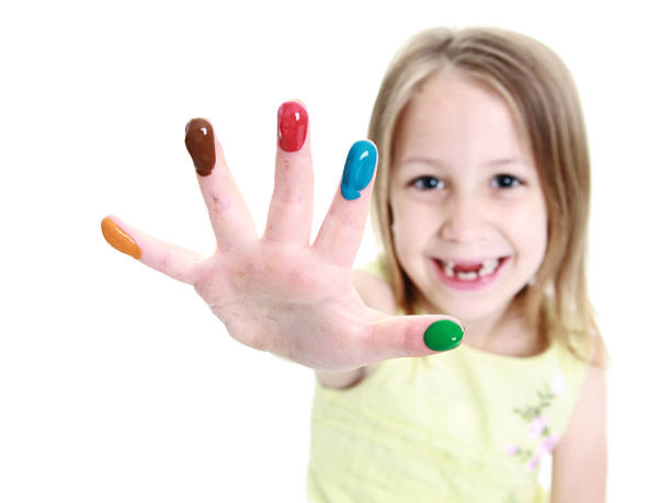 istock Cute young girl showing finger paints on her hand 160116917