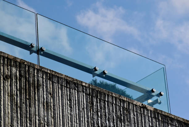 istock clear glass balustrade railing. laminated tempered safety glass. stone panel exterior elevation 1601174499