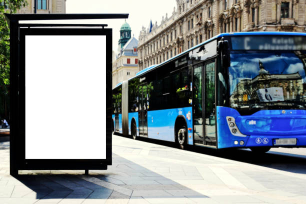 bus shelter with lightbox. blank white billboard ad panel at bus stop. sample template collage mockup image composite of bus shelter at a bus stop. sample template collage mockup. white poster ad and advertising display light box. aluminum structure. outdoor street perspective. modern blue bus in the station bus shelter stock pictures, royalty-free photos & images