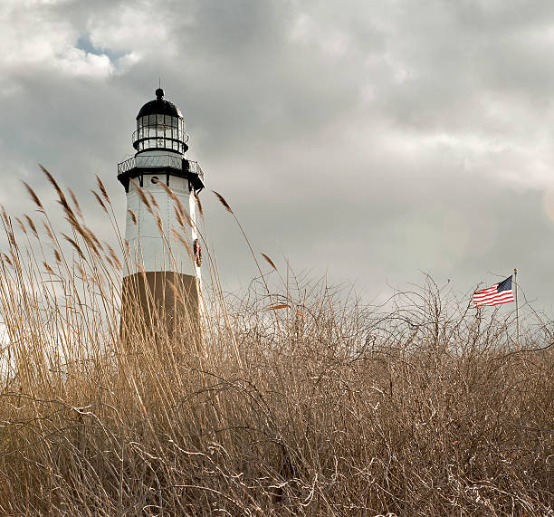 Low angle shot of a field outside Montauk Lighthouse This lighthouse is at the east end of Long Island. montauk point stock pictures, royalty-free photos & images