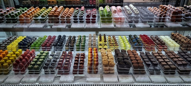 Jakarta, Indonesia - Aug 08, 2023: Colorful chocolate presented in the cooler glass cabinet