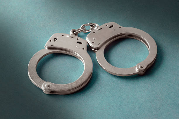 istock Pair of police handcuffs 160119281