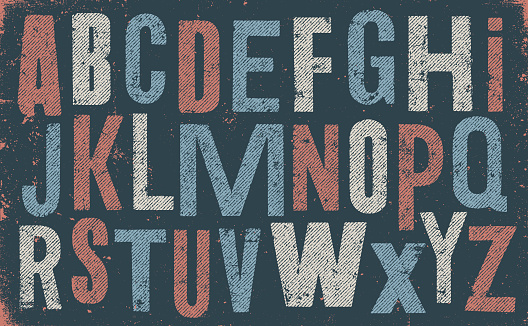 Distressed and old uppercase alphabet. Blue and red letters on black weathered texture background. Vector distressed capital letters alphabet with halftone textures.