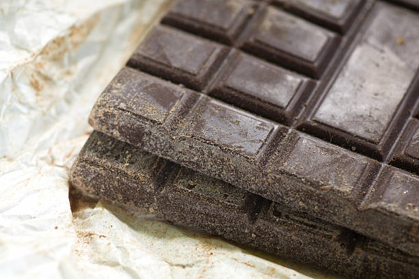 istock Bars of chocolate on white paper 160119781