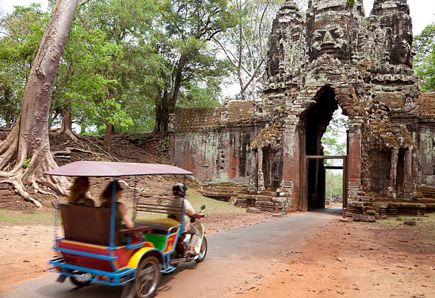 istock tuktuk touring at Angkor Thom, Cambodia 160120040