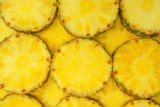 istock Pineapple juicy yellow slices as a background. 1601200688