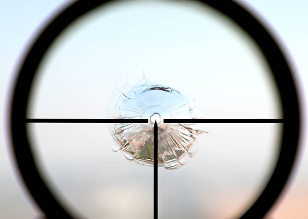 istock Bullet hole loocking thru the sniper 160121141