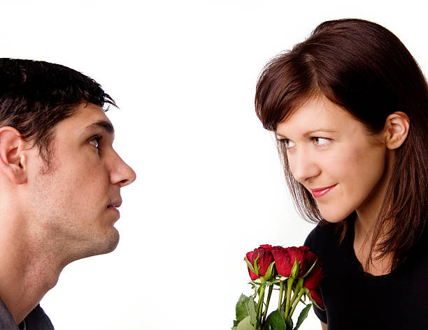 istock Man giving red roses to woman 160121379