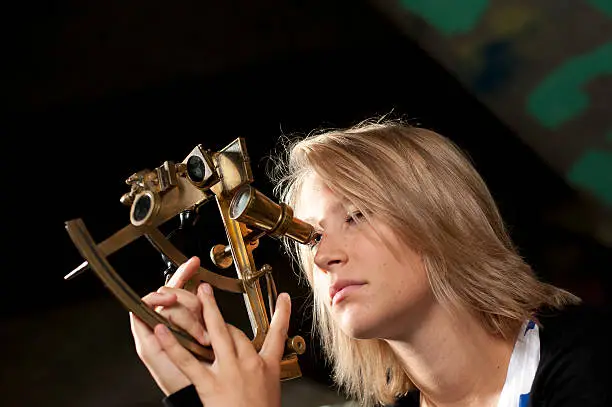 Young woman with sextant