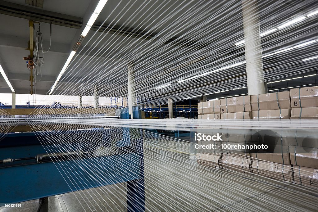 weaving weaving machine at a textile mill. Agricultural Machinery Stock Photo