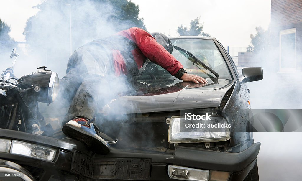 Accident Severe accident between a motorcyclist and a car, injuring both drivers and causing a lot of damage Motorcycle Stock Photo