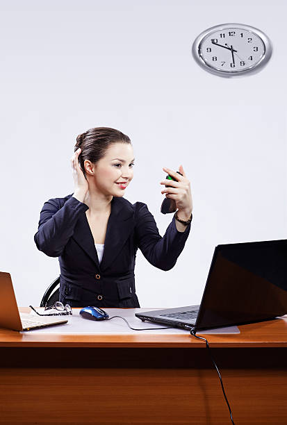 istock businesswoman with two laptops 160122954