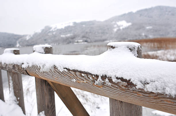 istock wood fence with snow 160123232