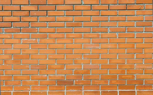 pomarańczowy mur z cegły - starting block zdjęcia i obrazy z banku zdjęć