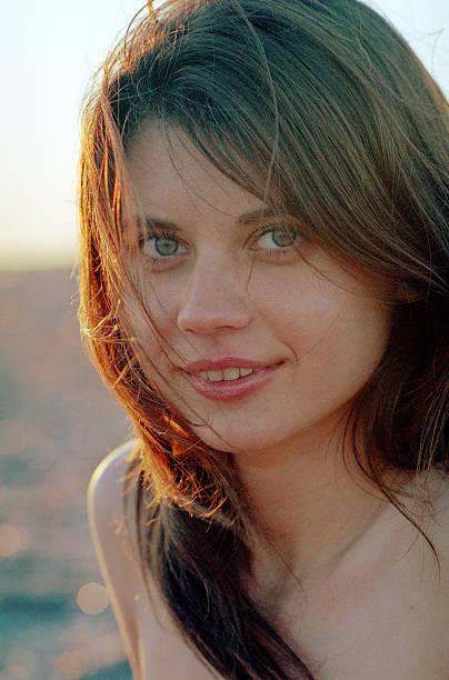 istock young woman relaxing at the beach 160123668
