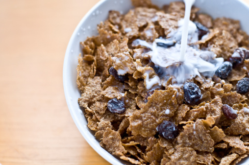 A raisin cereal with milk