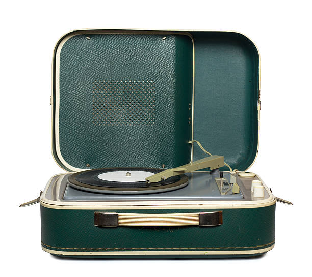 istock Green retro portable turntable playing a record 160124126