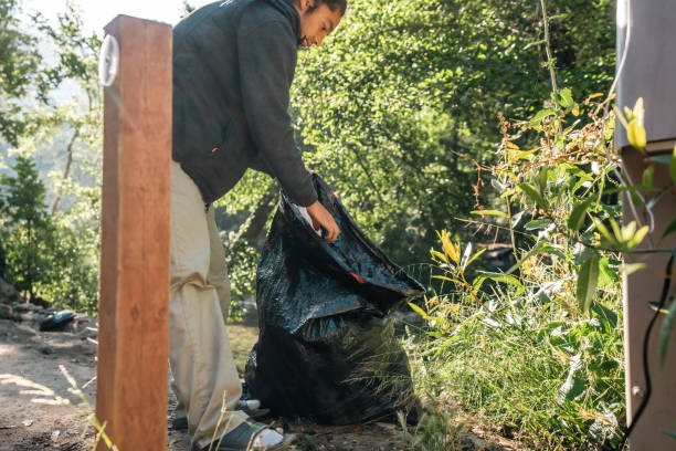istock Male Camper With Trash Bag at Big Sur Campsite 1601250021