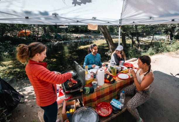 istock Four Friends Eating Breakfast at Big Sur Campsite 1601253211